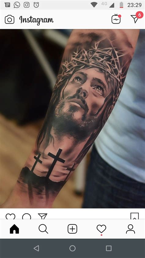 tatuajes de cristo en el brazo